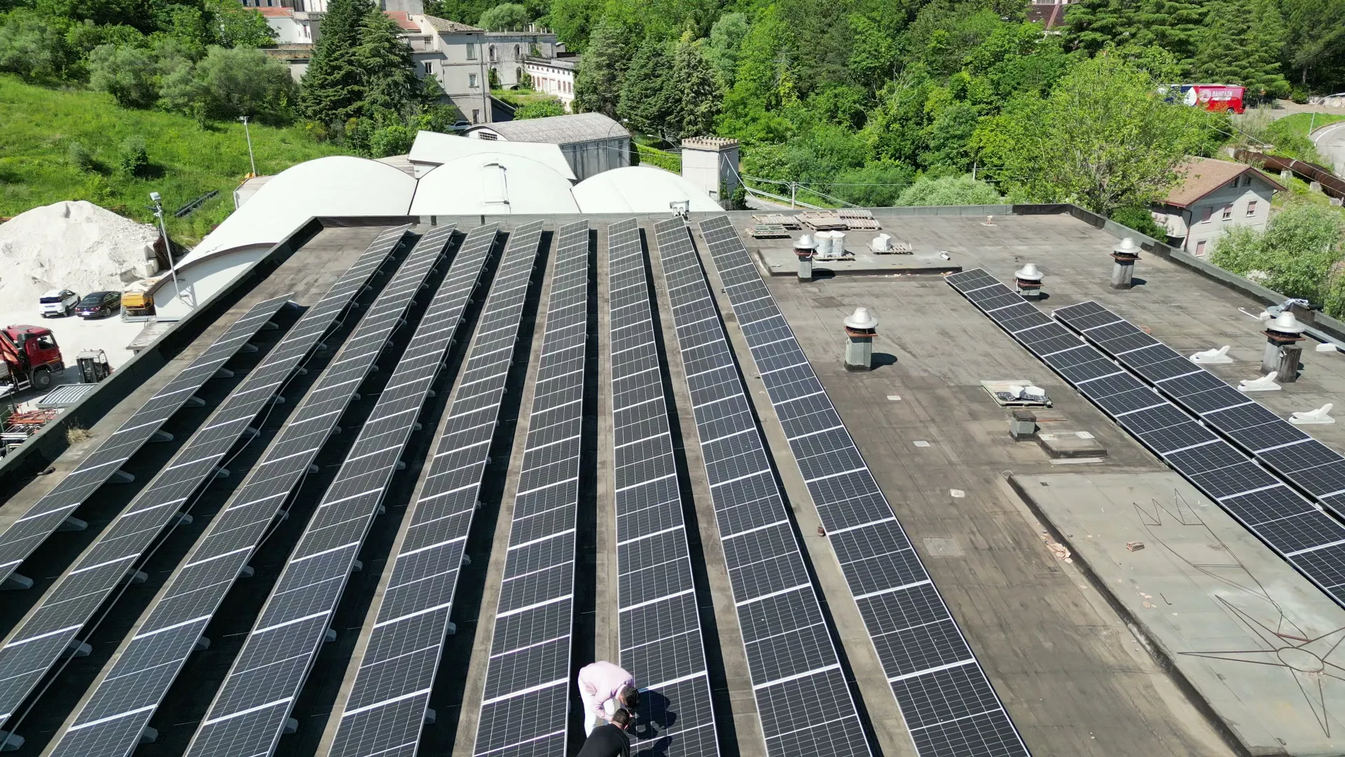 Rooftop of the Pastificio Cocco plant with its solar system, among the mountains
