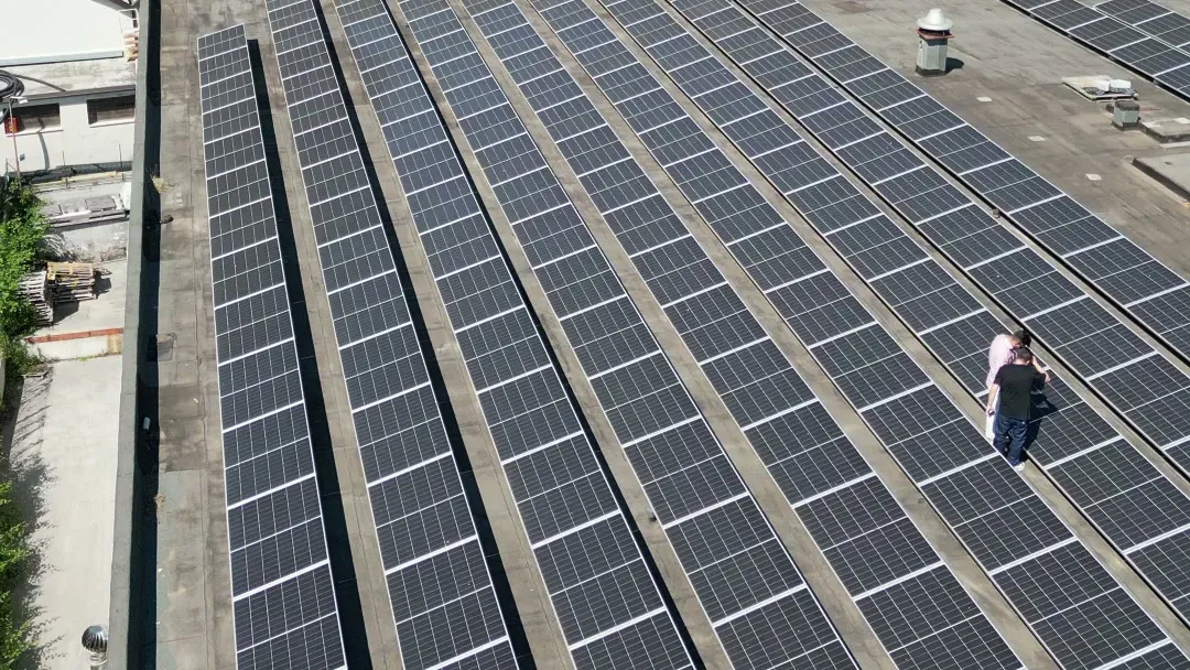 New Energy technician checking a rooftop array