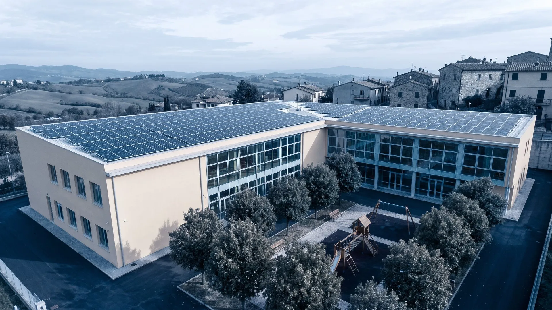 School building with a rooftop solar system (illustrative image)